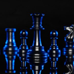 chess-figures-black-background-with-blue-backlight_93675-62392